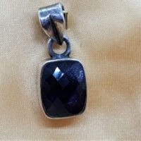 rectangular facetted iolite in silver pendant