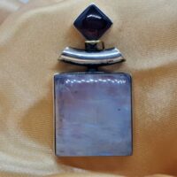 Square rainbow moonstone and garnet in silver pendant