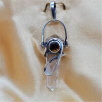 double terminated polished quartz point with fancy silver setting and round facetted citrine