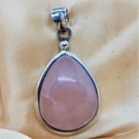 large tear drop shaped rose quartz in silver pendant