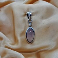 oval rose quartz in silver pendant