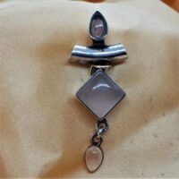 rose quartz in silver pendant with square main stone and two tear drop stones one at the top and one on the base