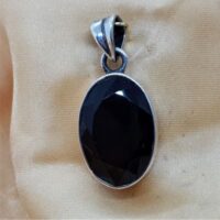 oval faceted smokey quartz in silver pendant