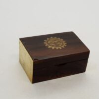 small wood and brass 'pill' box with brass end and sun design