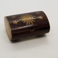 small wooden oval 'pill' box sun and stars design in brass with brass ends