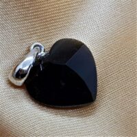 small tektite heart pendant on silver bail