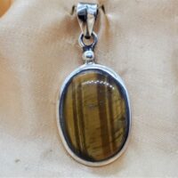 oval tiger eye in silver pendant