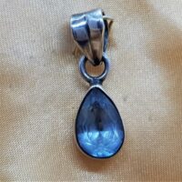 teardrop shaped faceted blue topaz in silver pendant