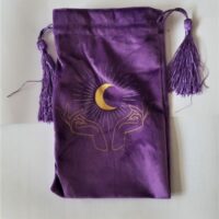 purple tarot bag with hands and crescent moon