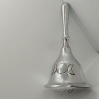 triple moon silver coloured hand bell