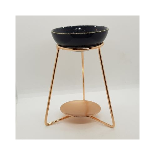 purple star sign and copper effect oil burner